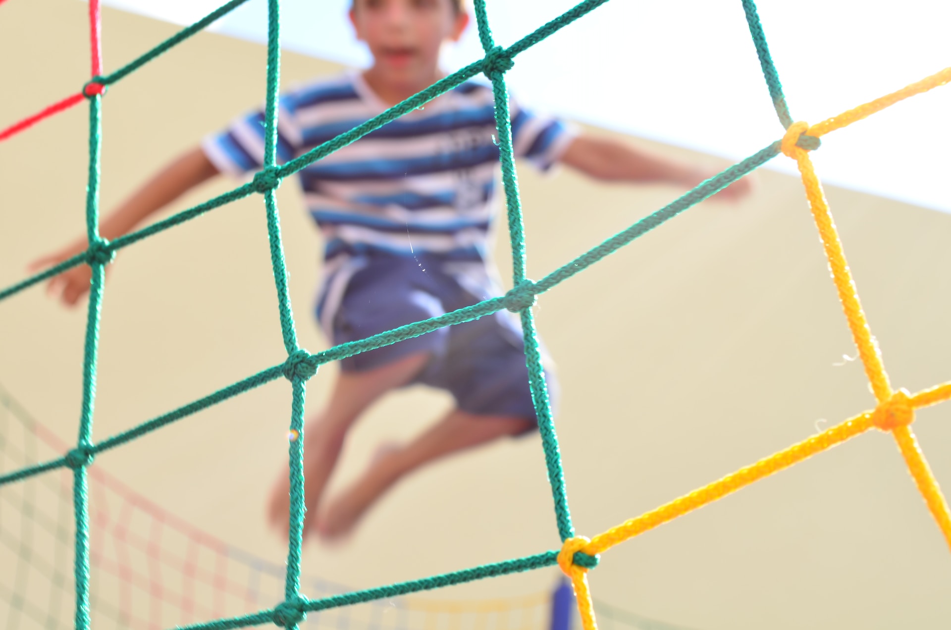 child using a trampoline